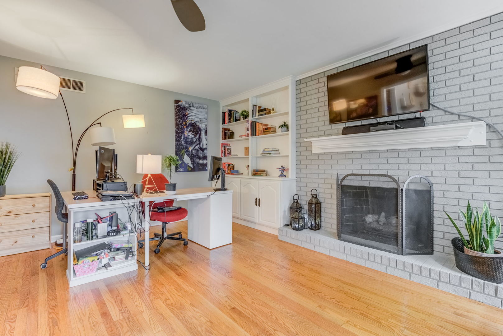 1220 Arthur Road Naperville, IL 60540 - Photo 12 of 24 a living room with furniture a flat screen tv and a fireplace