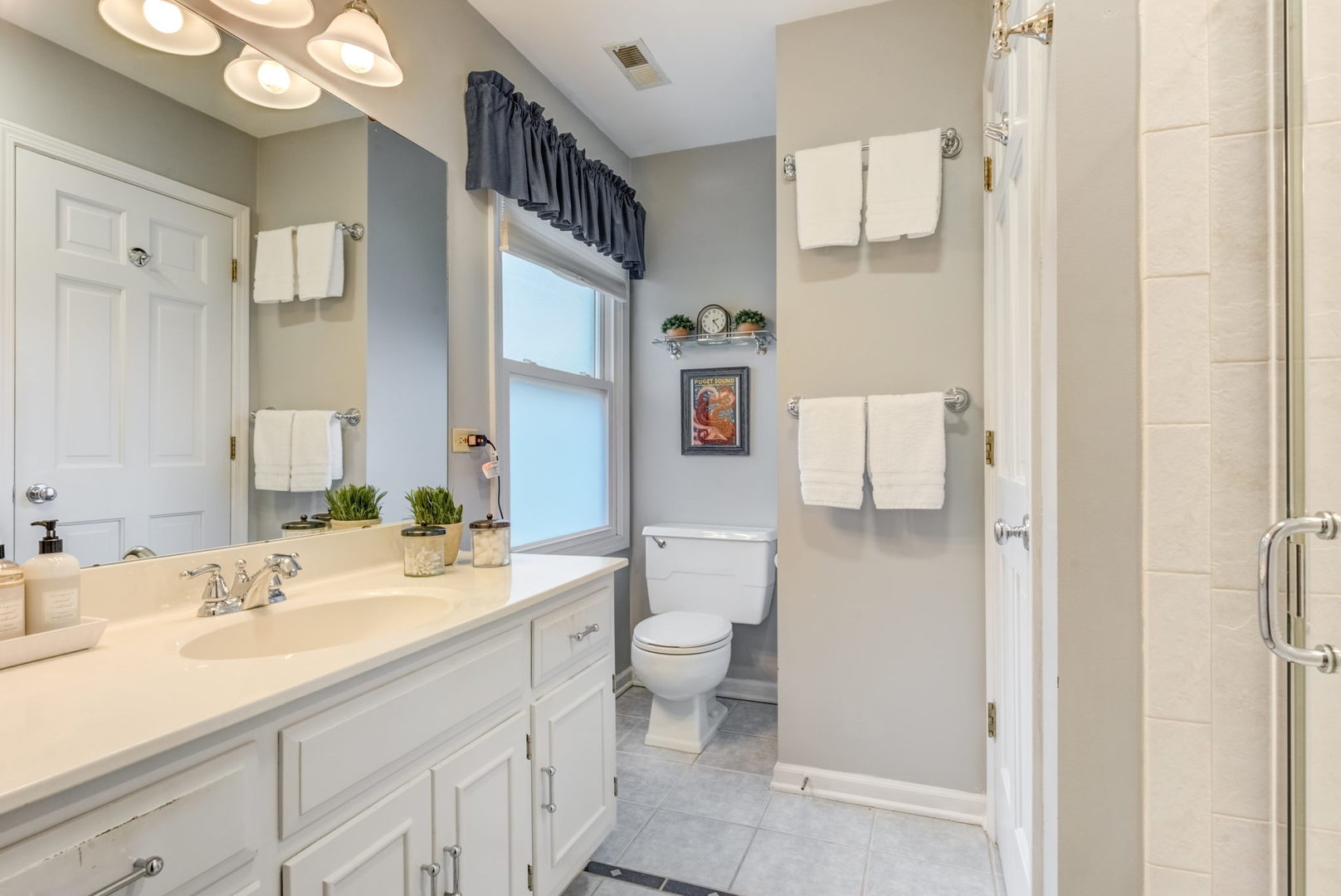 1220 Arthur Road Naperville, IL 60540 - Photo 15 of 24 a bathroom with a sink double vanity and a mirror