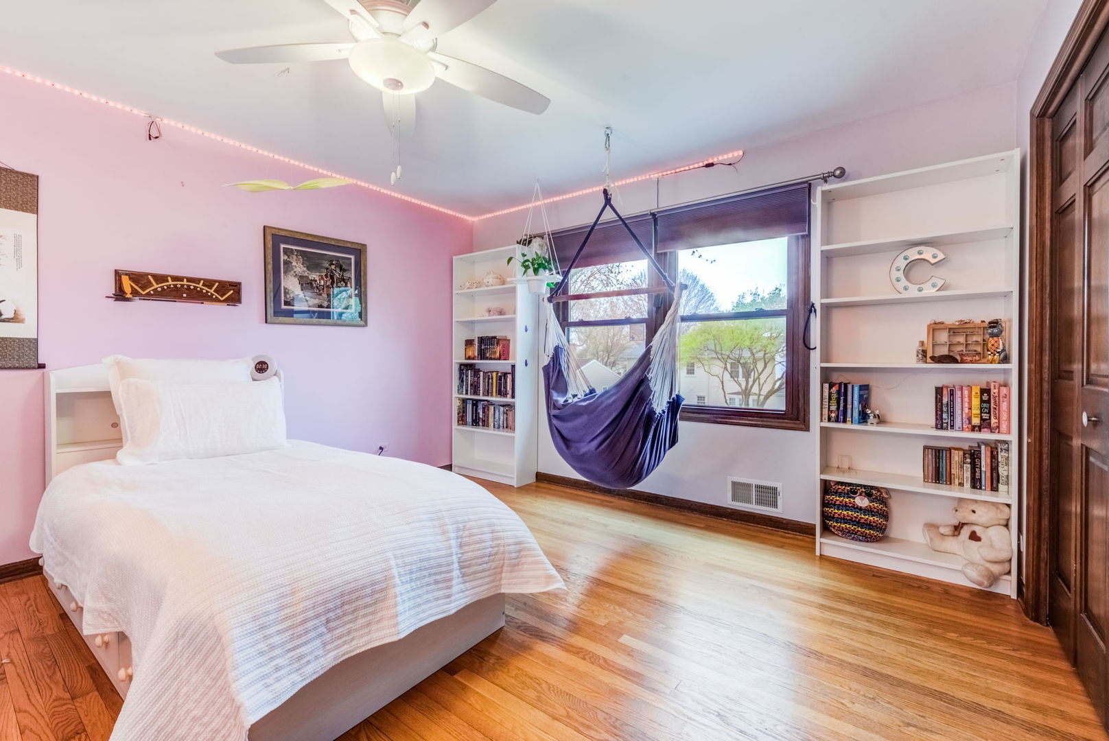 1220 Arthur Road Naperville, IL 60540 - Photo 17 of 24 a bedroom with a bed and a bookshelf