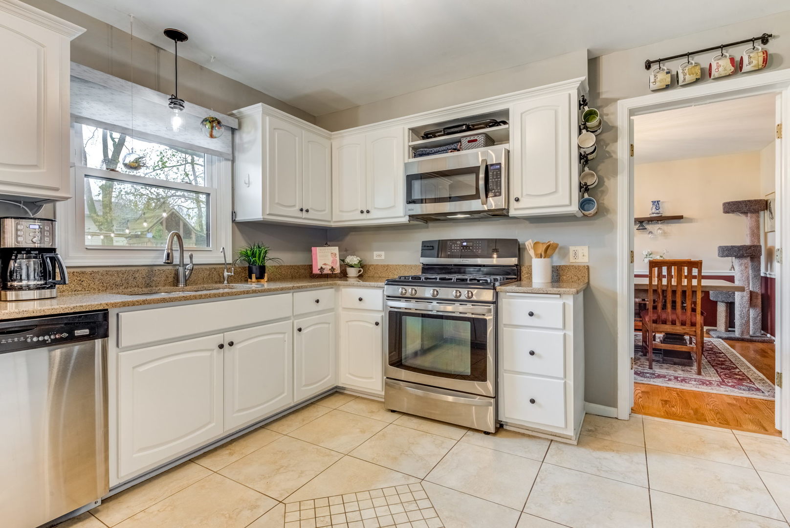 1220 Arthur Road Naperville, IL 60540 - Photo 7 of 24 a kitchen with stainless steel appliances granite countertop a stove and a sink