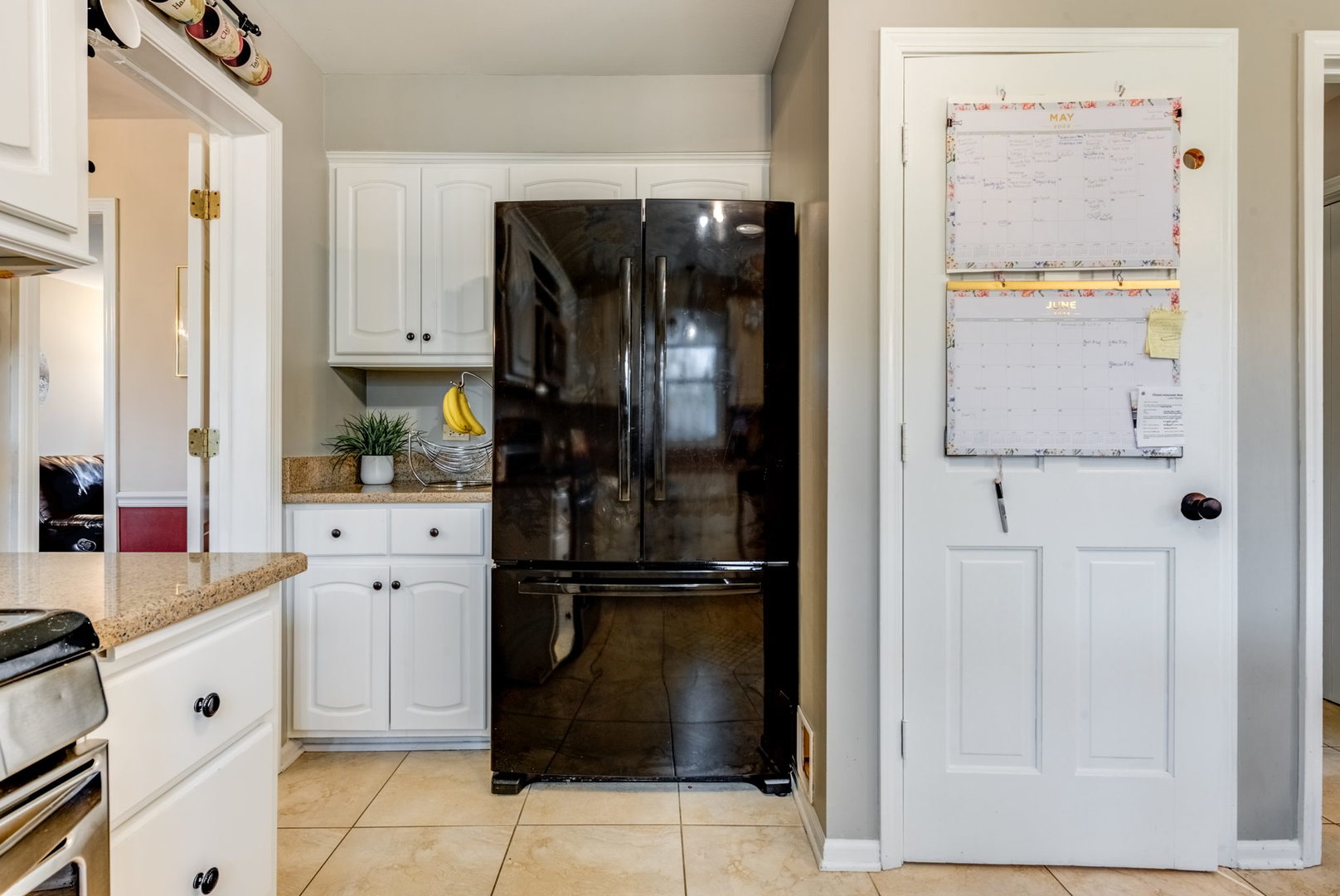 1220 Arthur Road Naperville, IL 60540 - Photo 8 of 24 a kitchen with white cabinets and refrigerator