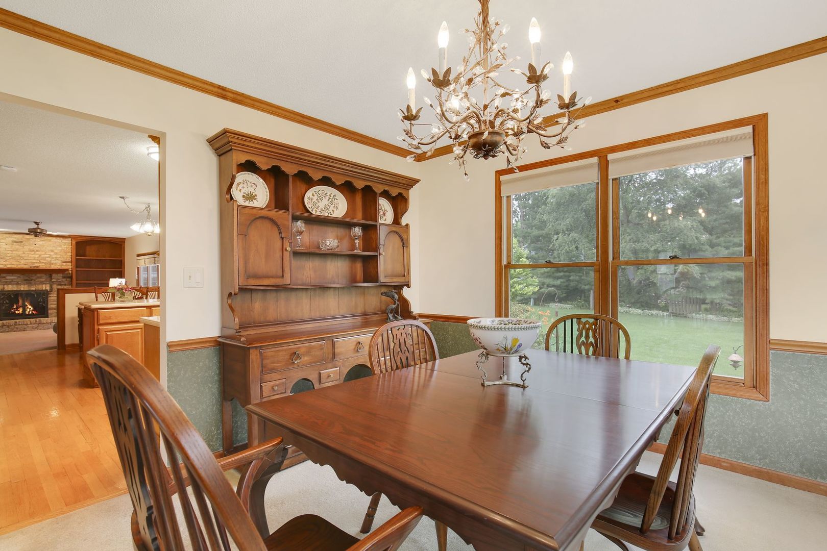 152 Wilcox Drive Bartlett, IL 60103 - Photo 11 of 51 a view of a dining room with furniture a chandelier and wooden floor