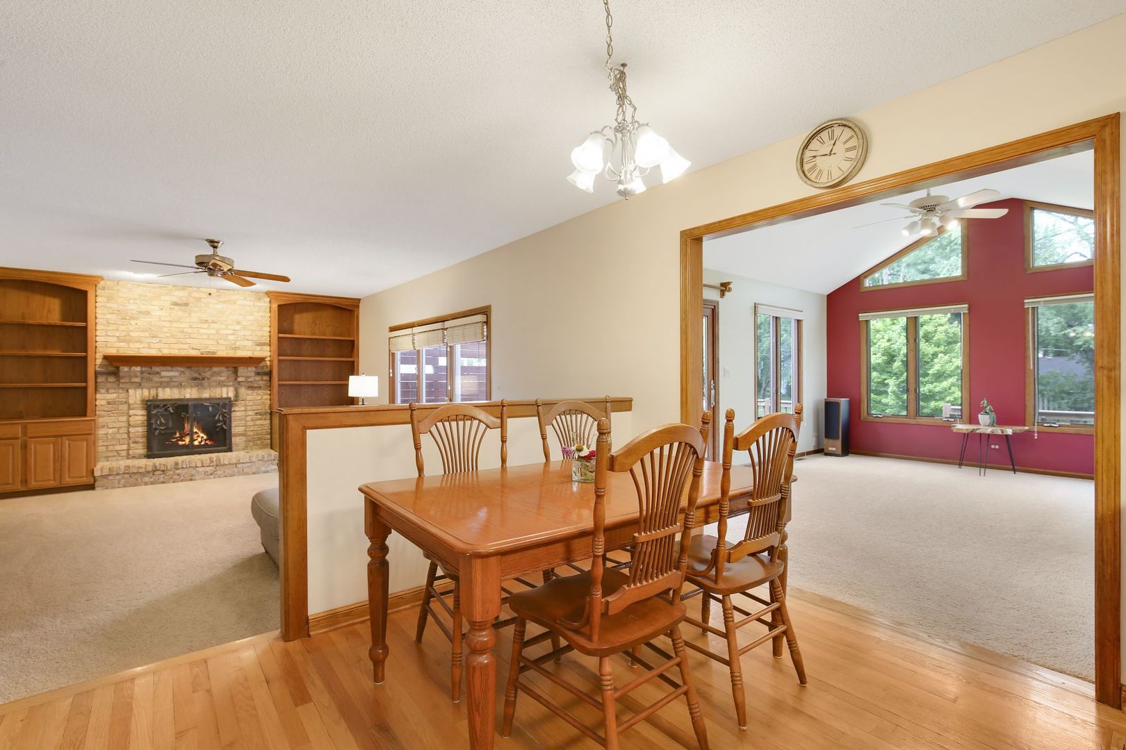 152 Wilcox Drive Bartlett, IL 60103 - Photo 12 of 51 a view of a dining room with furniture a chandelier and wooden floor