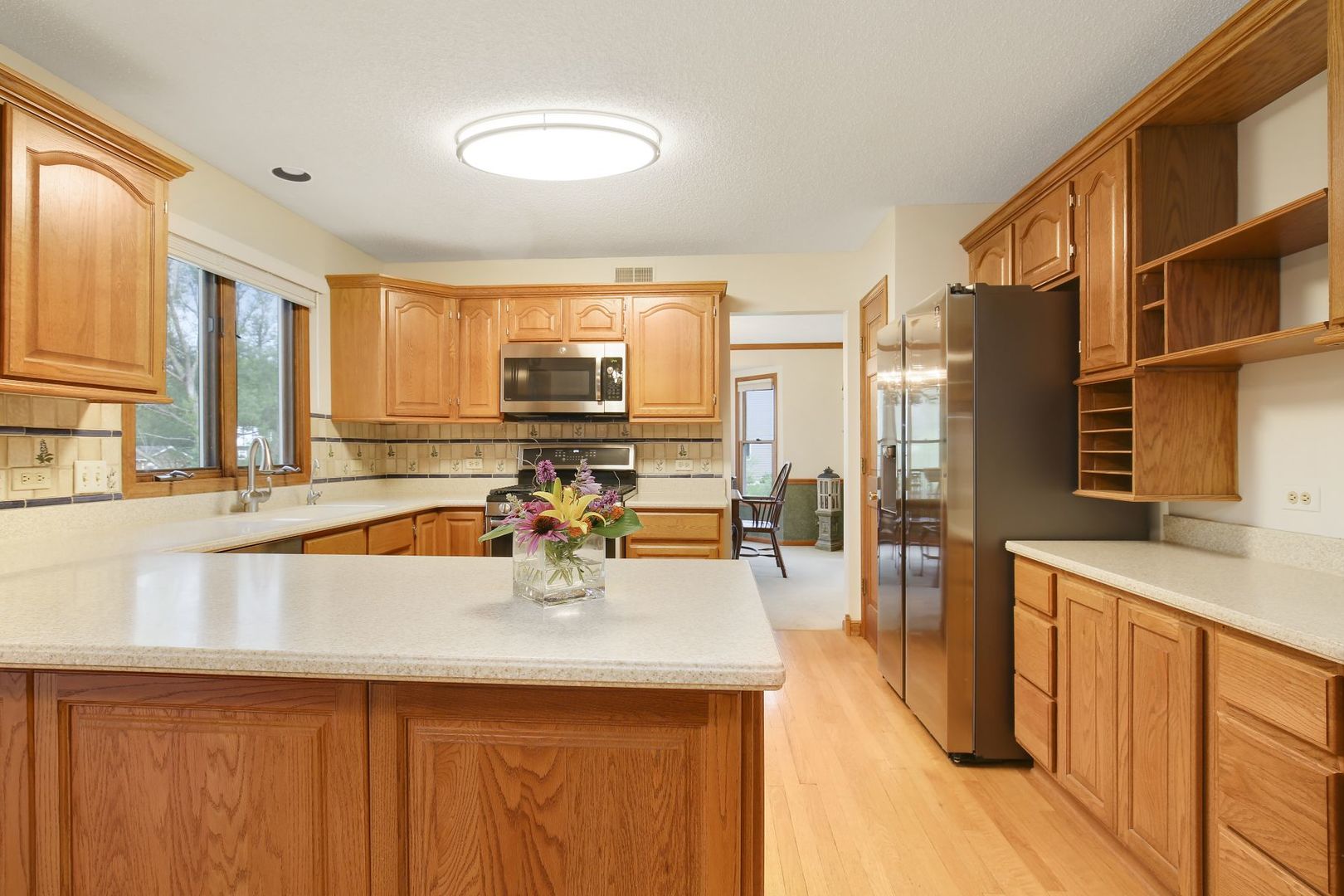 152 Wilcox Drive Bartlett, IL 60103 - Photo 14 of 51 a view of a kitchen with kitchen island a sink appliances and cabinets