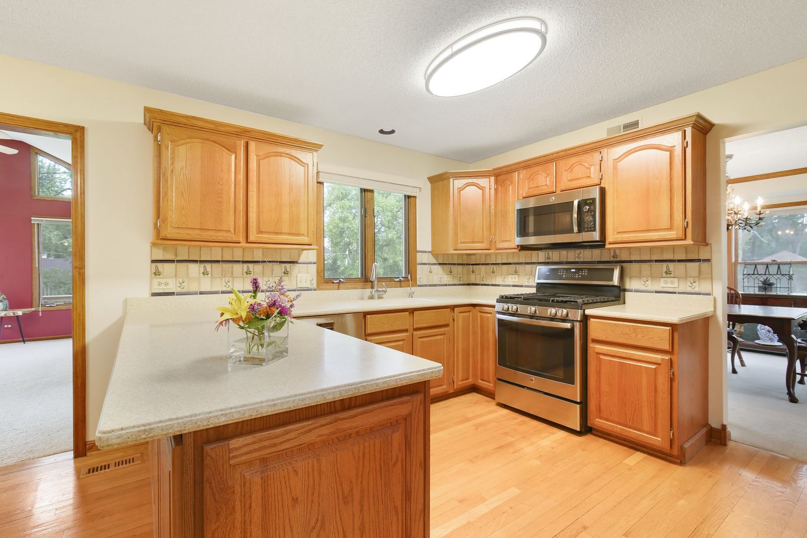 152 Wilcox Drive Bartlett, IL 60103 - Photo 15 of 51 a kitchen with stainless steel appliances granite countertop a sink stove and microwave