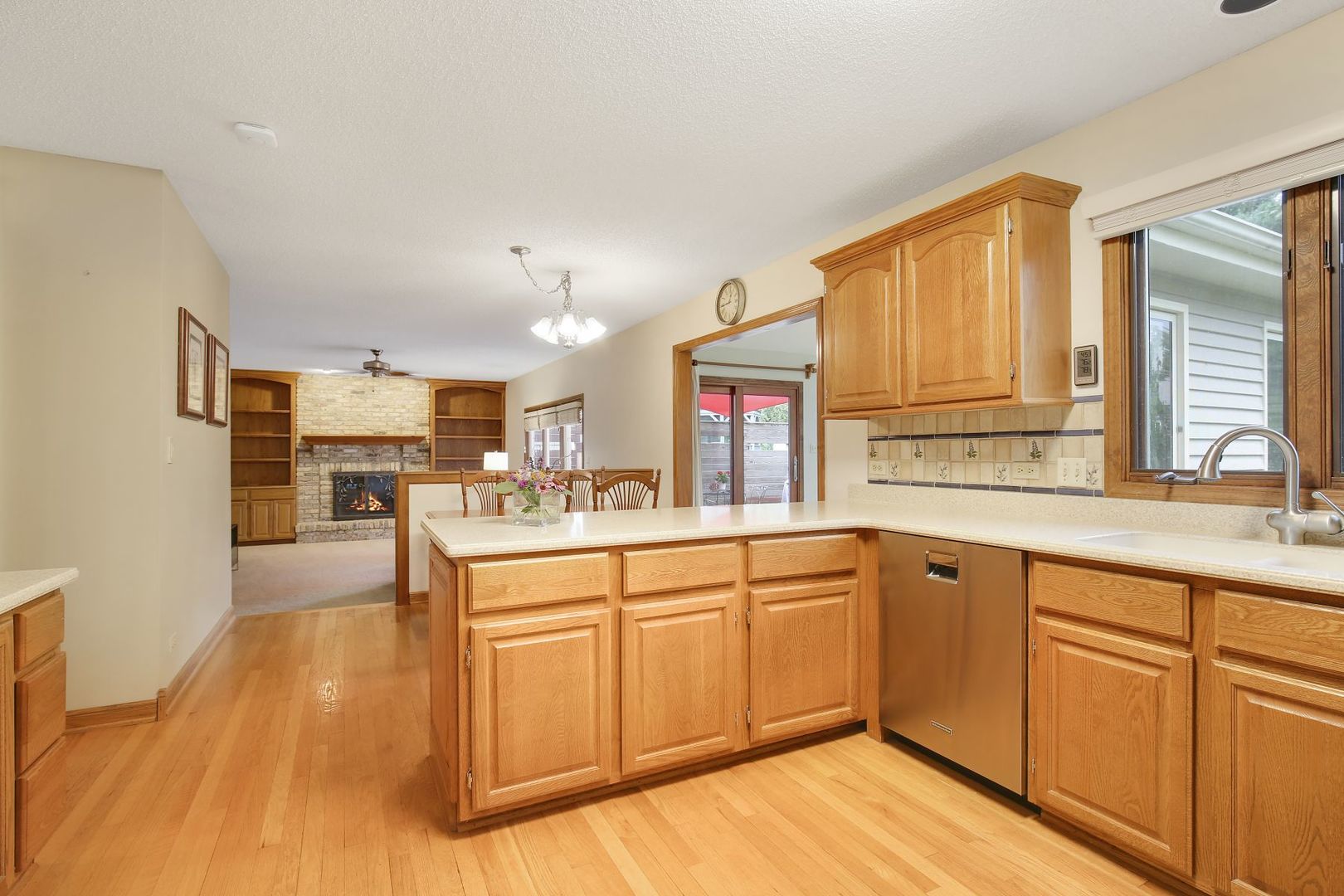 152 Wilcox Drive Bartlett, IL 60103 - Photo 16 of 51 a large kitchen with kitchen island a sink white cabinets and stainless steel appliances