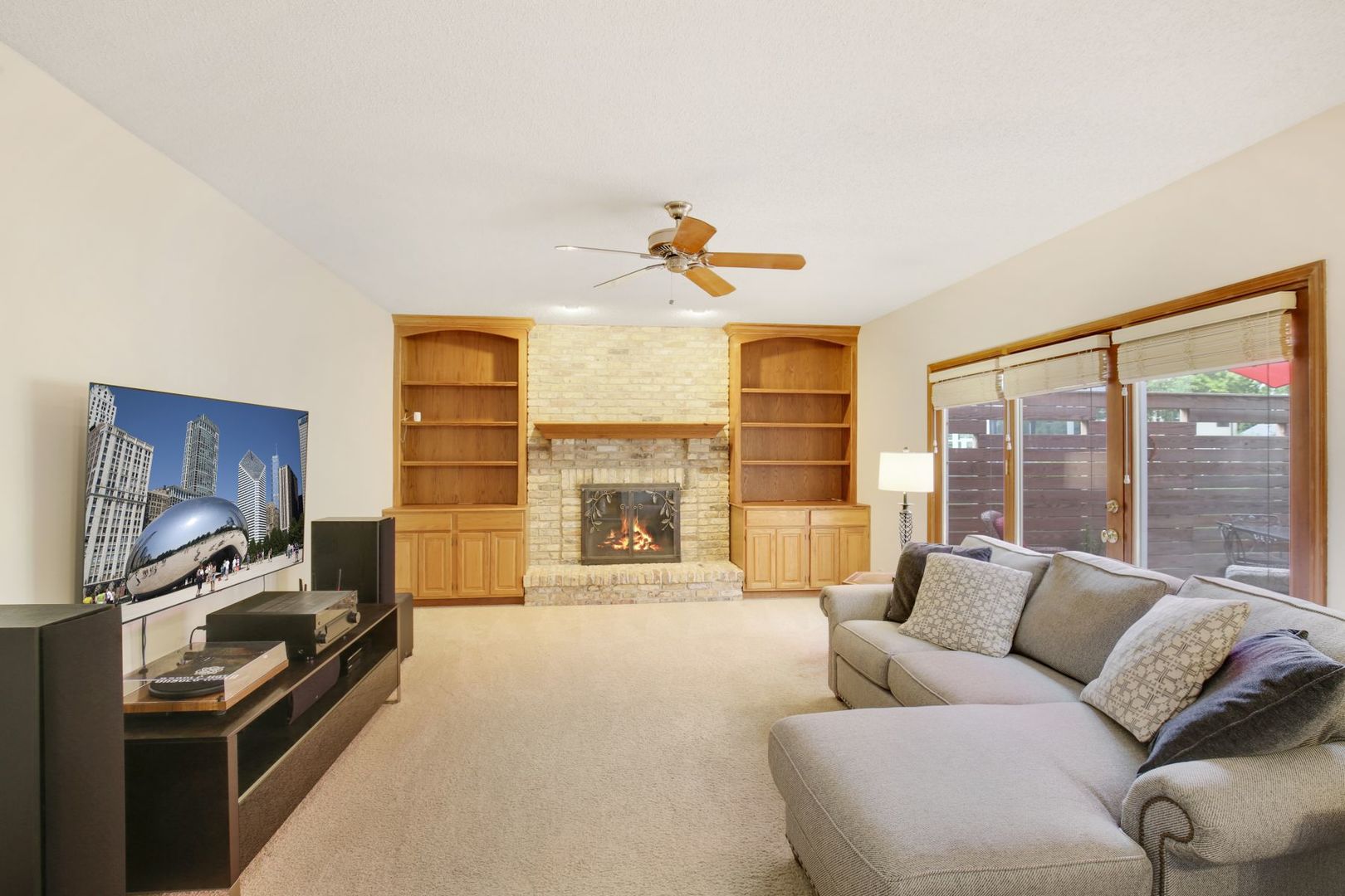 152 Wilcox Drive Bartlett, IL 60103 - Photo 17 of 51 a living room with furniture flat screen tv and a fireplace