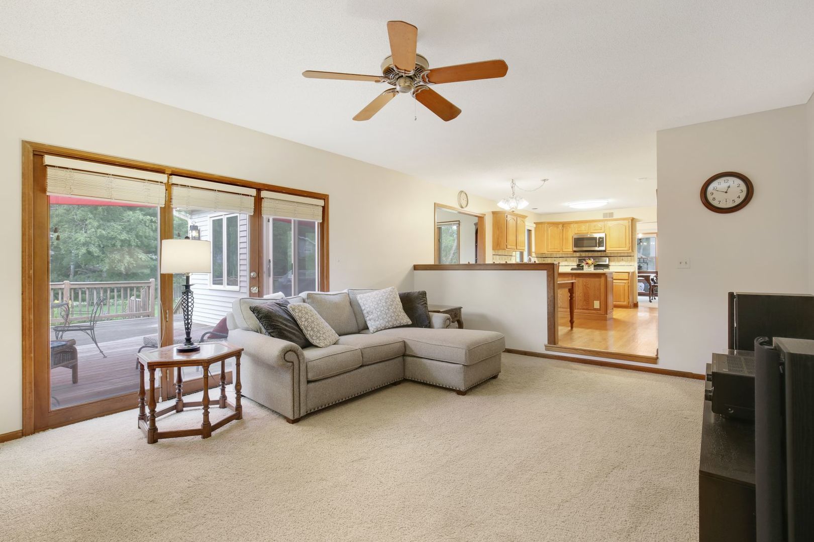 152 Wilcox Drive Bartlett, IL 60103 - Photo 18 of 51 a living room with furniture a flat screen tv and a large window