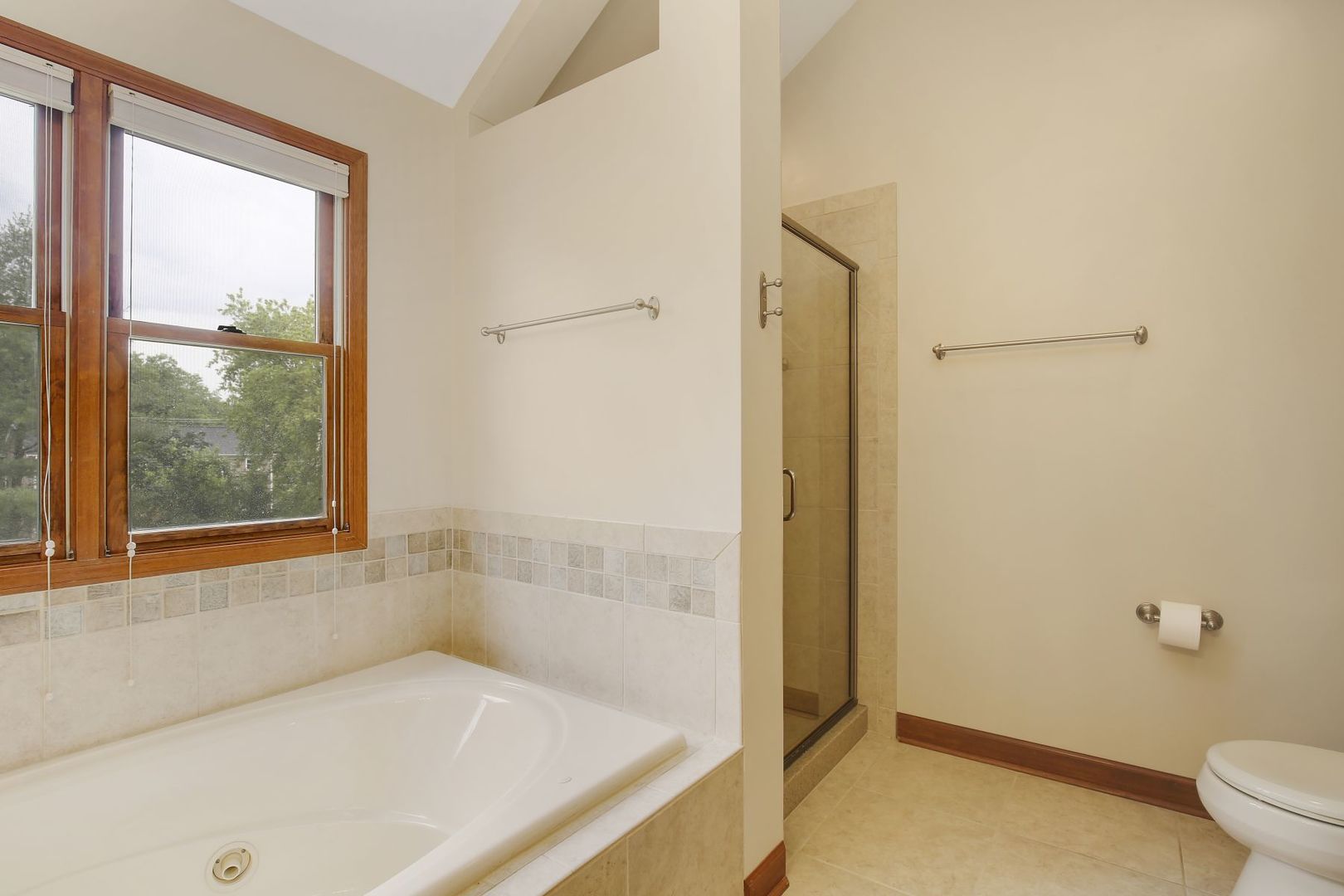 152 Wilcox Drive Bartlett, IL 60103 - Photo 27 of 51 a white bath tub sitting next to a toilet