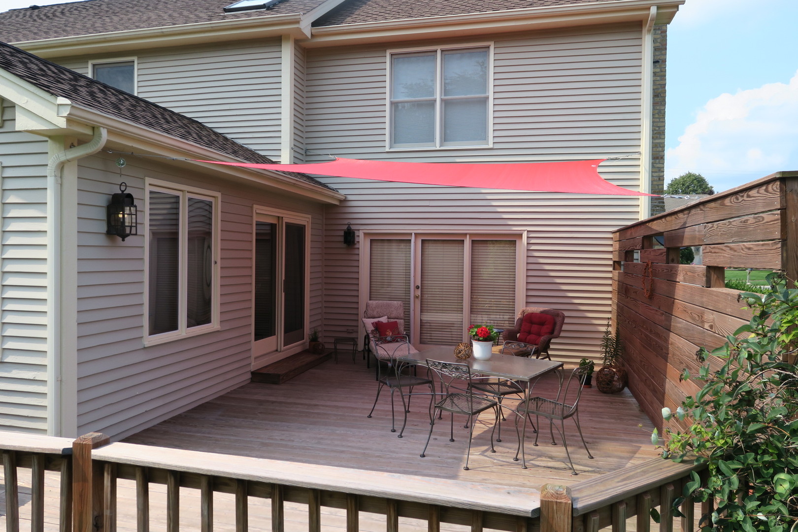 152 Wilcox Drive Bartlett, IL 60103 - Photo 45 of 51 a view of a house with a chairs and table in a patio