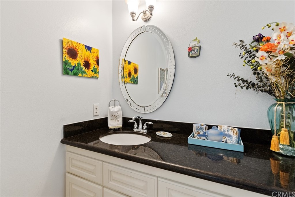 10 Mandrake Way Irvine, CA 92612 - Photo 17 of 35 a bathroom with a sink and a mirror