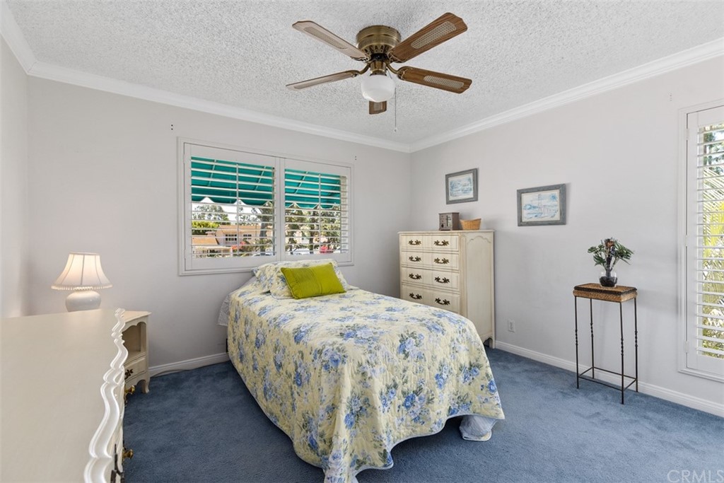 10 Mandrake Way Irvine, CA 92612 - Photo 18 of 35 a bed room with a bed and a chandelier