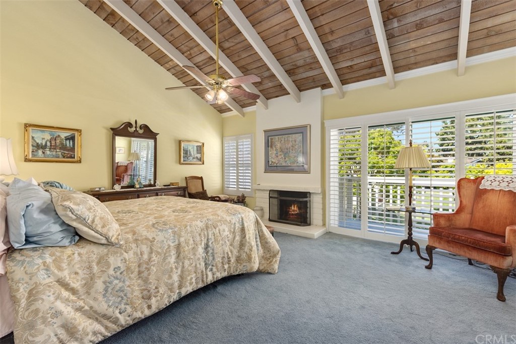 10 Mandrake Way Irvine, CA 92612 - Photo 22 of 35 a spacious bedroom with a bed a couch and walk in closet