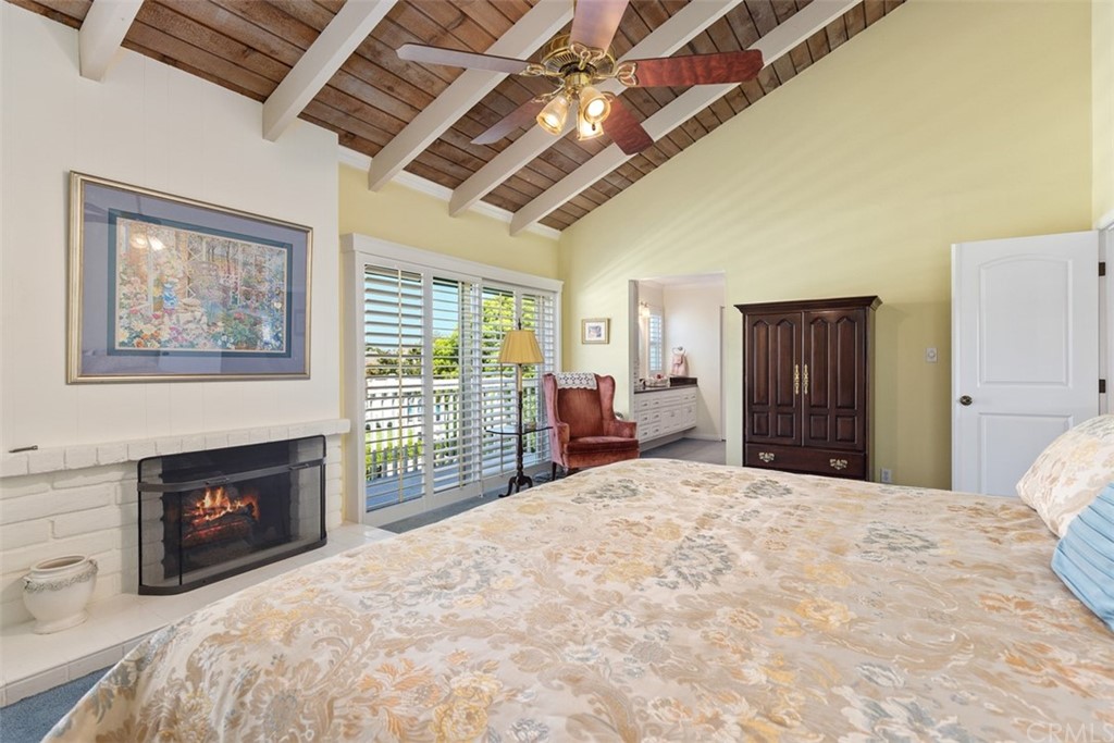 10 Mandrake Way Irvine, CA 92612 - Photo 23 of 35 a large bedroom with a bed and a fireplace