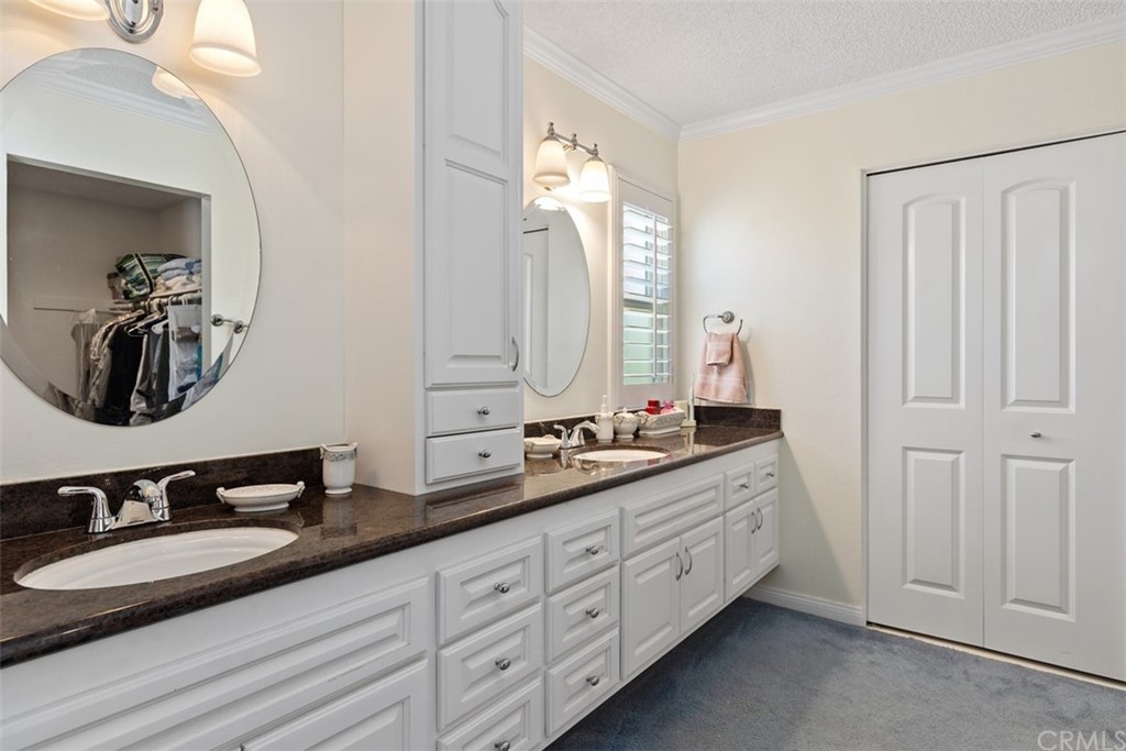 10 Mandrake Way Irvine, CA 92612 - Photo 24 of 35 a bathroom with double sink and a mirror