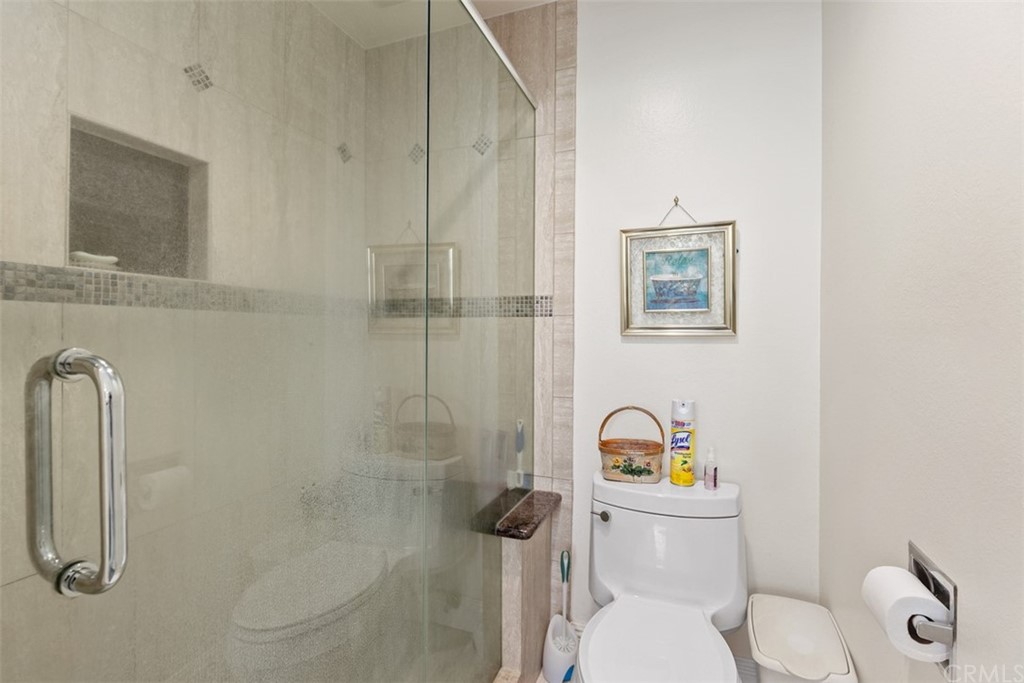 10 Mandrake Way Irvine, CA 92612 - Photo 25 of 35 a white toilet sitting next to a bathroom sink