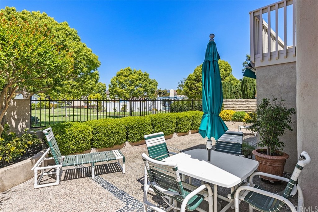 10 Mandrake Way Irvine, CA 92612 - Photo 28 of 35 a view of a chairs and table in backyard