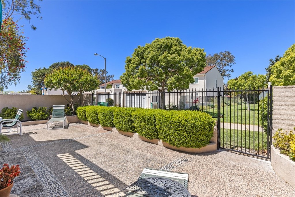 10 Mandrake Way Irvine, CA 92612 - Photo 30 of 35 a view of a backyard with a garden
