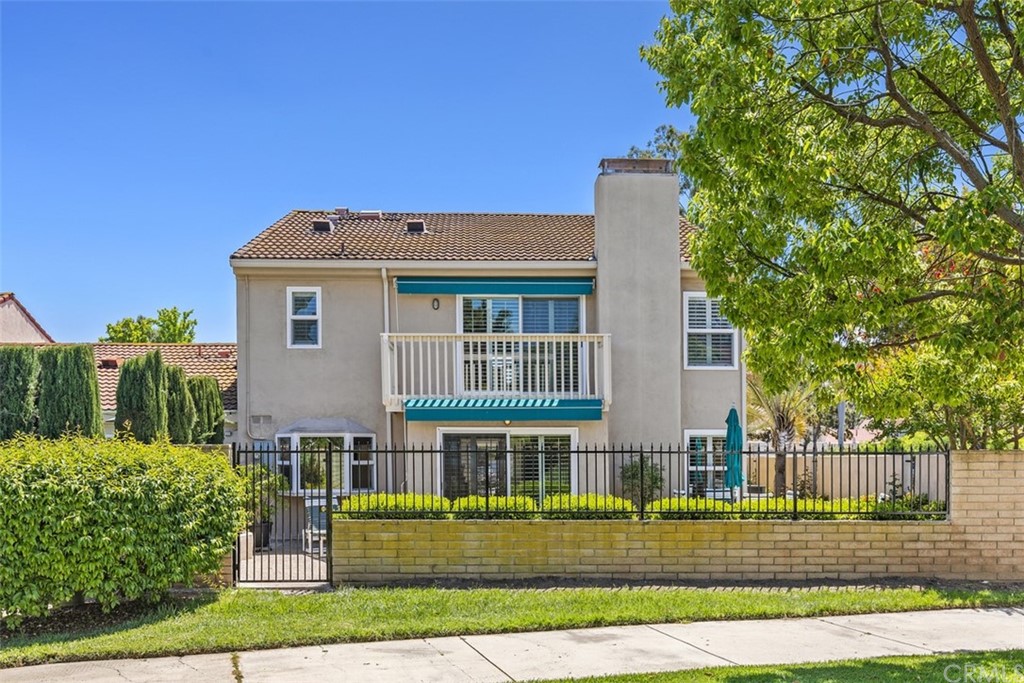 10 Mandrake Way Irvine, CA 92612 - Photo 31 of 35 a front view of a house with a garden