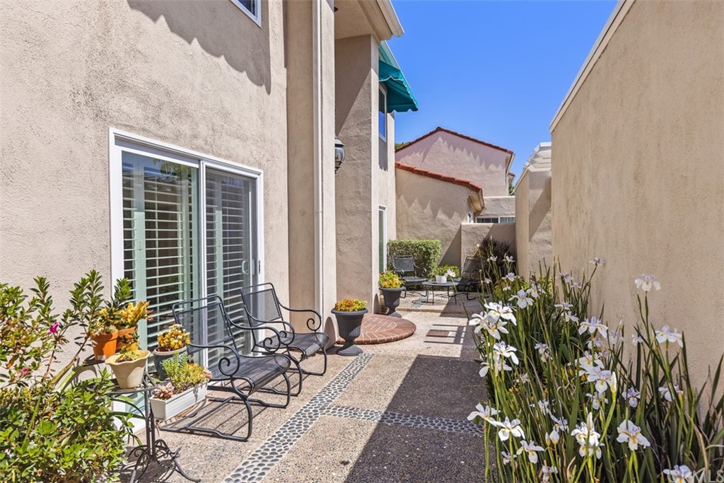 10 Mandrake Way Irvine, CA 92612 - Photo 5 of 35 a house with potted plants in front of it