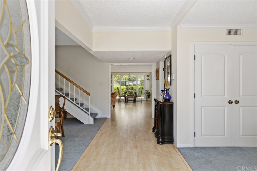 10 Mandrake Way Irvine, CA 92612 - Photo 6 of 35 a hallway with wooden floor windows and stairs