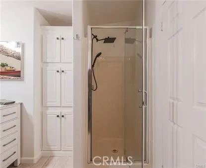 a bedroom with a large bed and a large window