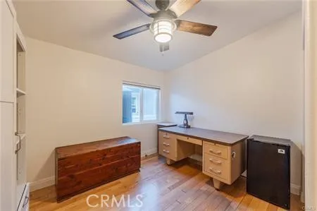 a bedroom with a large bed and a large window