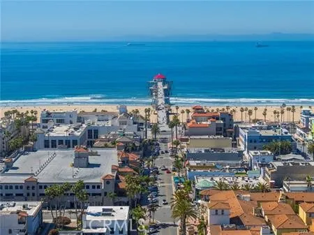 an aerial view of residential building with ocean view