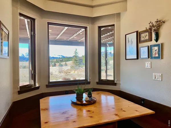 a room with wooden floor and window