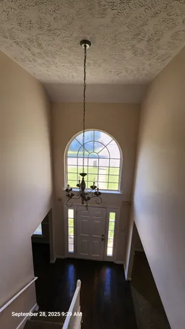 a view of entryway with a front door