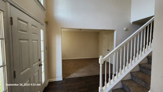 a view of staircase with wooden floor and stairs