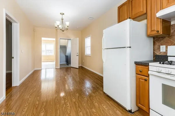 a kitchen with a sink a counter top space and stainless steel appliances
