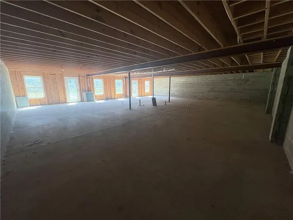 a view of room with a wooden door