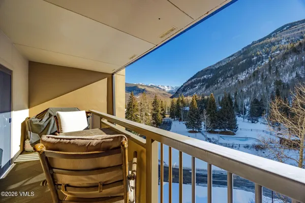 a view of balcony with furniture