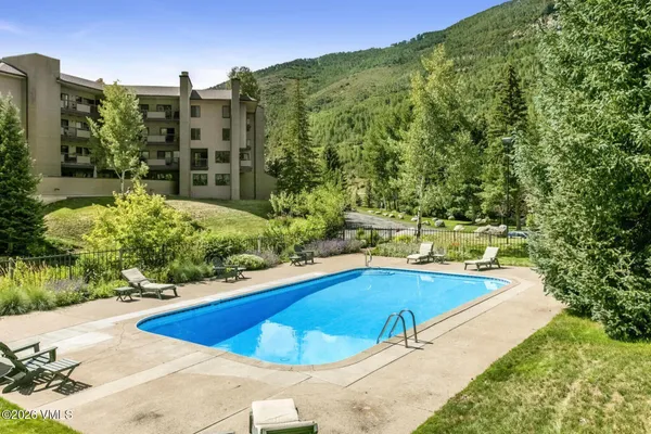a view of a swimming pool with a patio