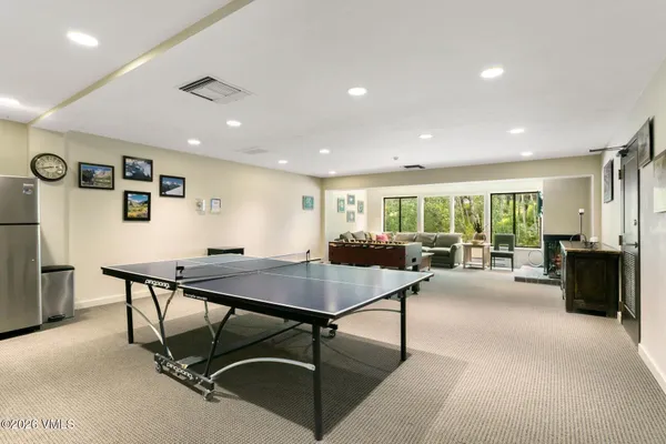 a view of a work space with furniture and window
