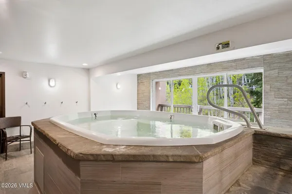 a bath tub sitting next to a window