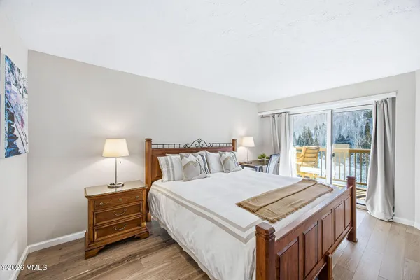 a bedroom with a bed and a table