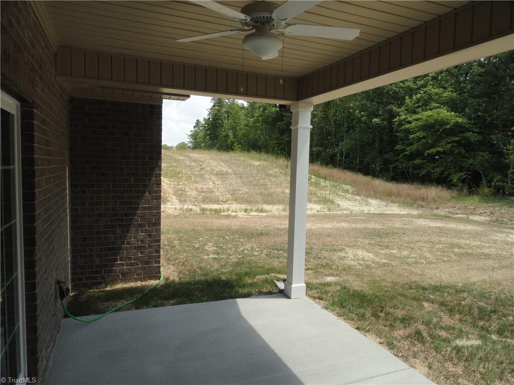 2814 Fallin Court High Point, NC 27262 - Photo 11 of 16 Covered patio off sunroom with fan