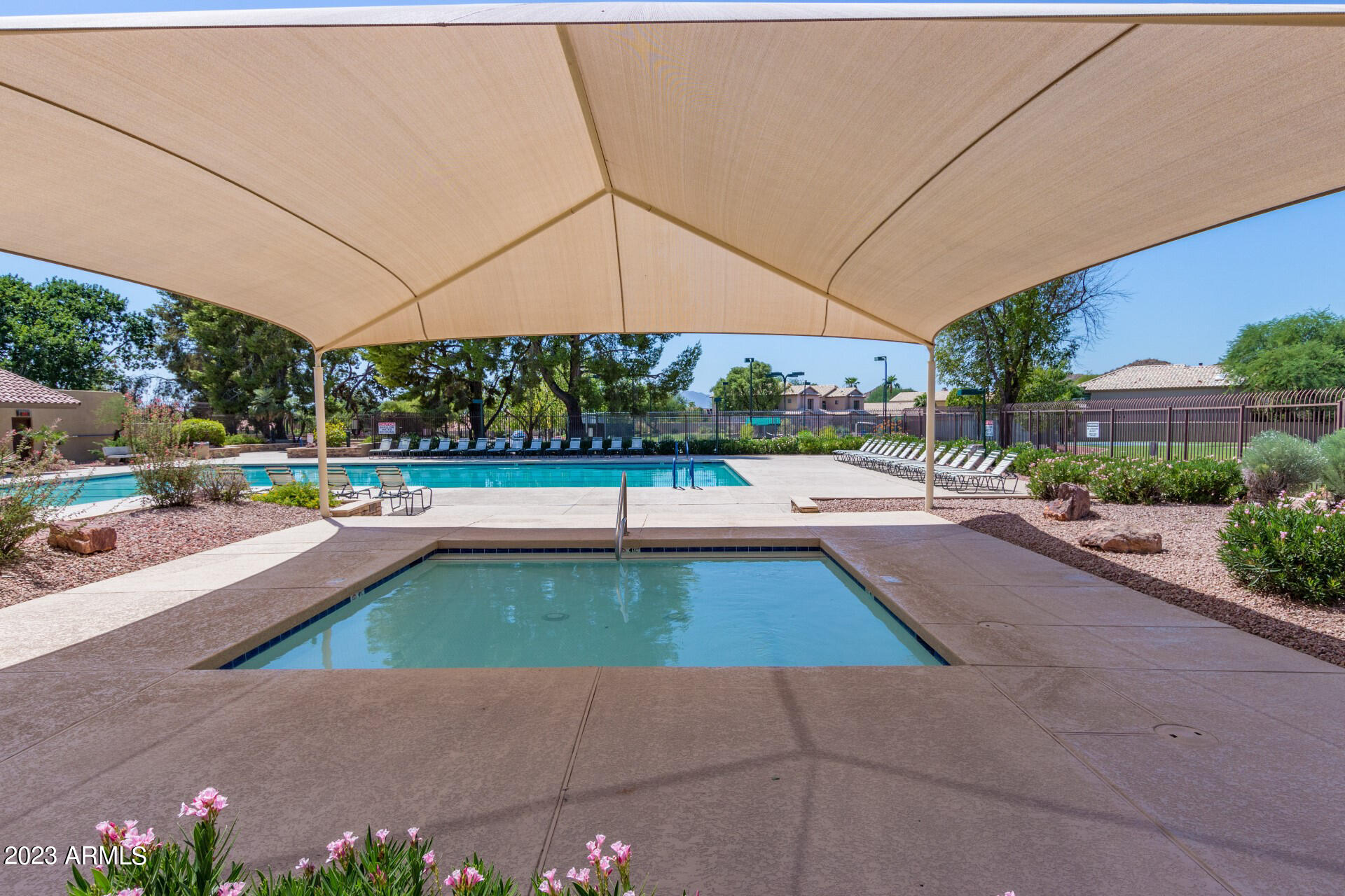 4266 East Agave Road Phoenix, AZ 85044 - Photo 41 of 54 a view of a swimming pool with a yard