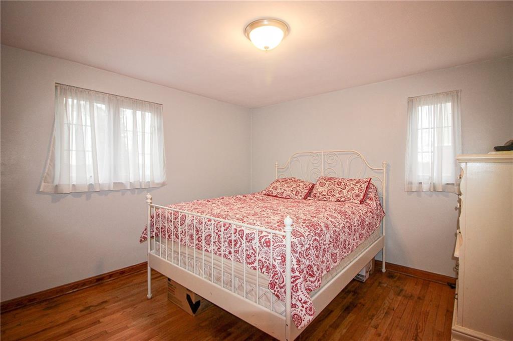 164 Gill Hall Road Clairton, PA 15025 - Photo 11 of 30 a bedroom with a bed and wooden floor