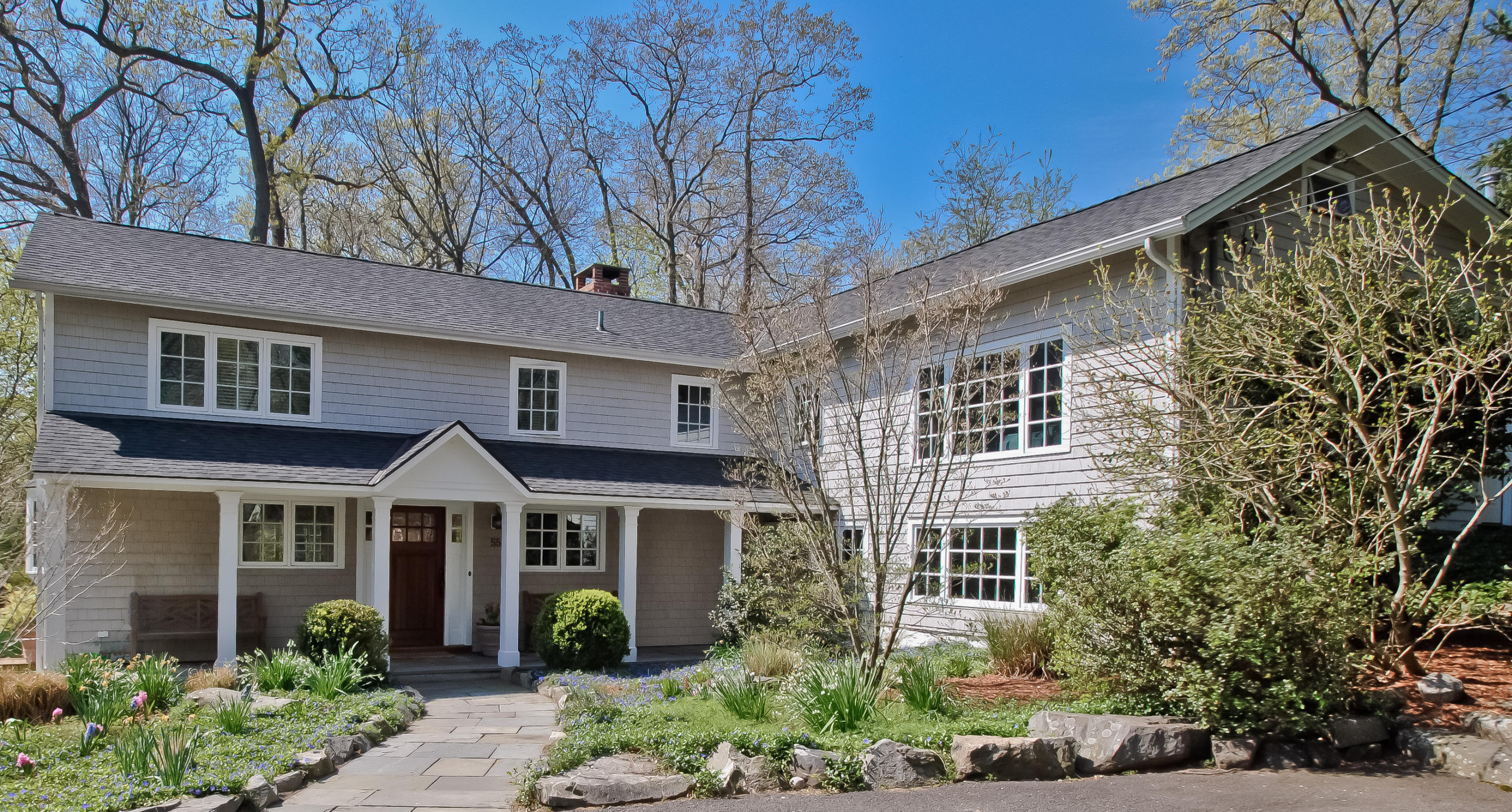 55 Cedar Gate Road Darien, CT 06820 - Photo 1 of 41 a front view of a house with garden