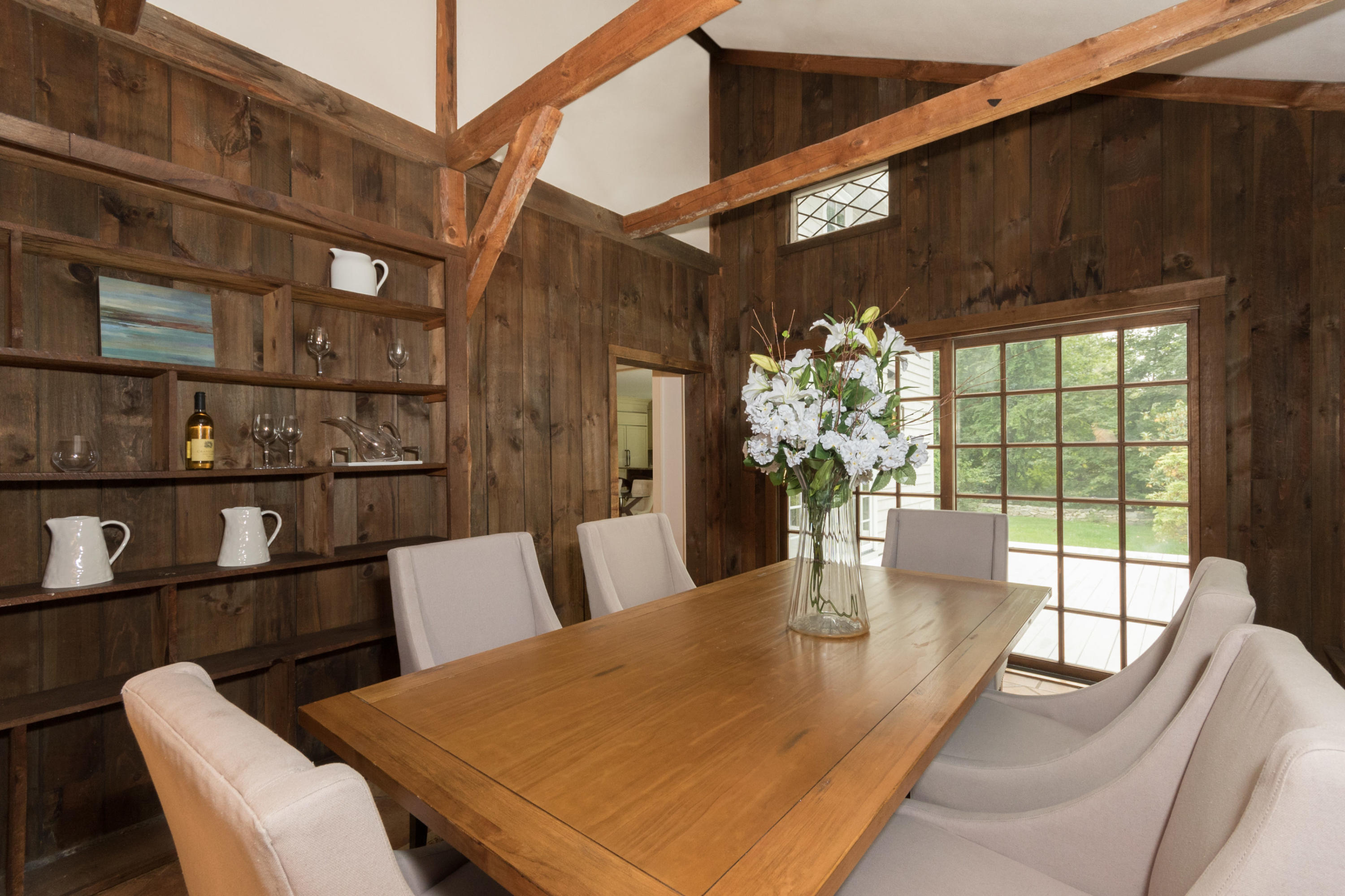 55 Cedar Gate Road Darien, CT 06820 - Photo 12 of 41 a dining room with furniture and a potted plant