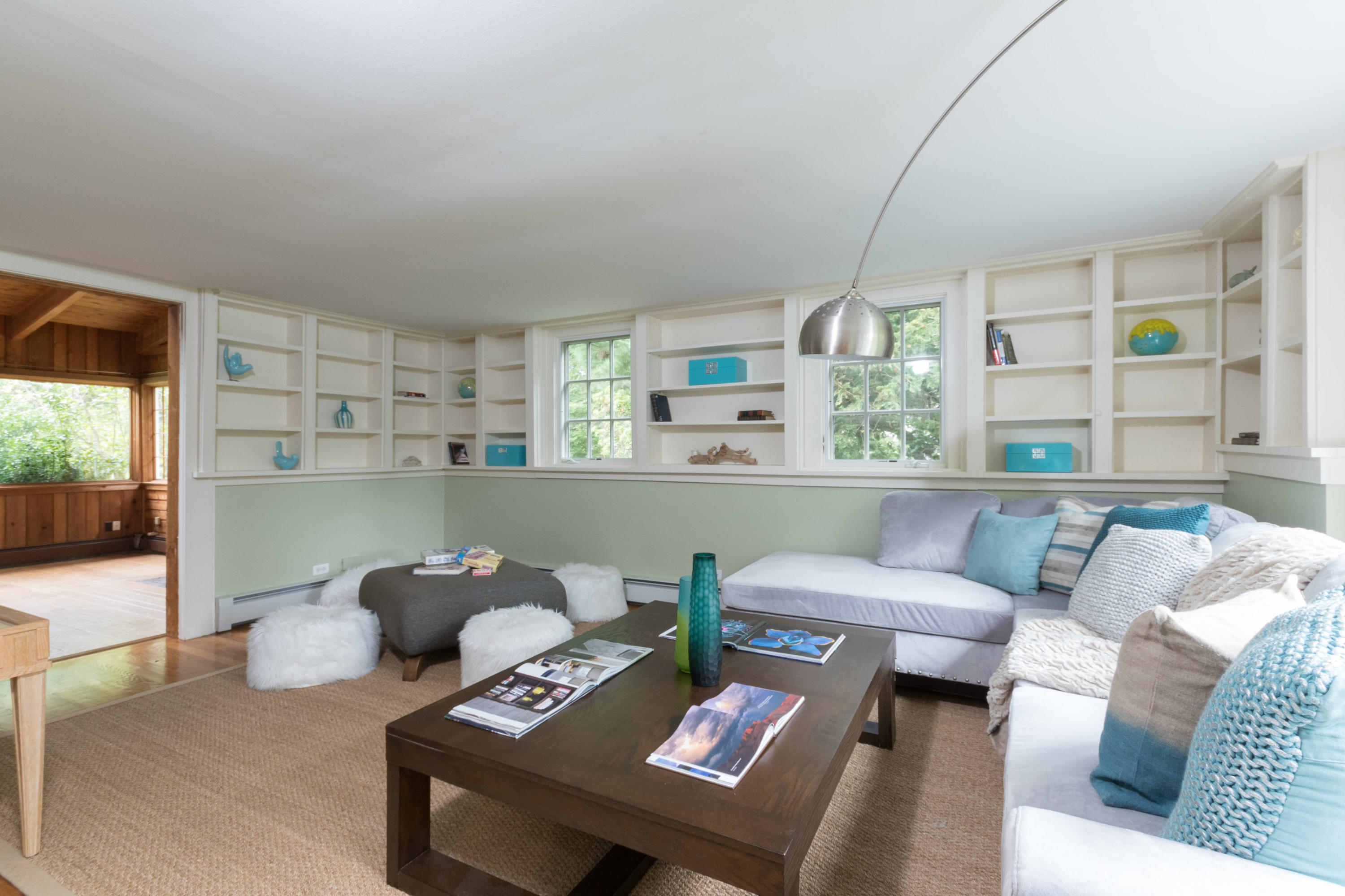 55 Cedar Gate Road Darien, CT 06820 - Photo 13 of 41 a living room with furniture and a book shelf