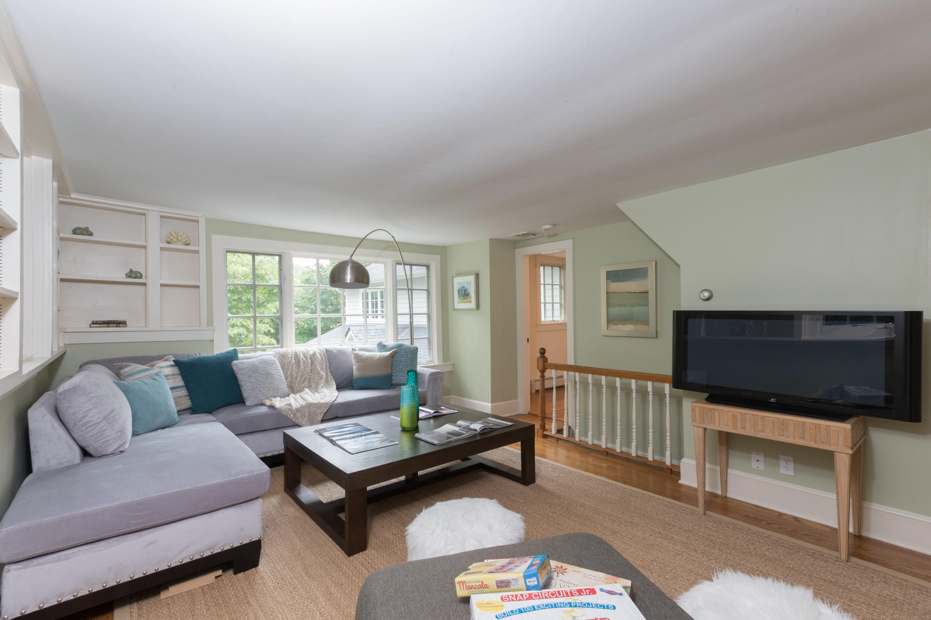 55 Cedar Gate Road Darien, CT 06820 - Photo 14 of 41 a living room with furniture and a flat screen tv