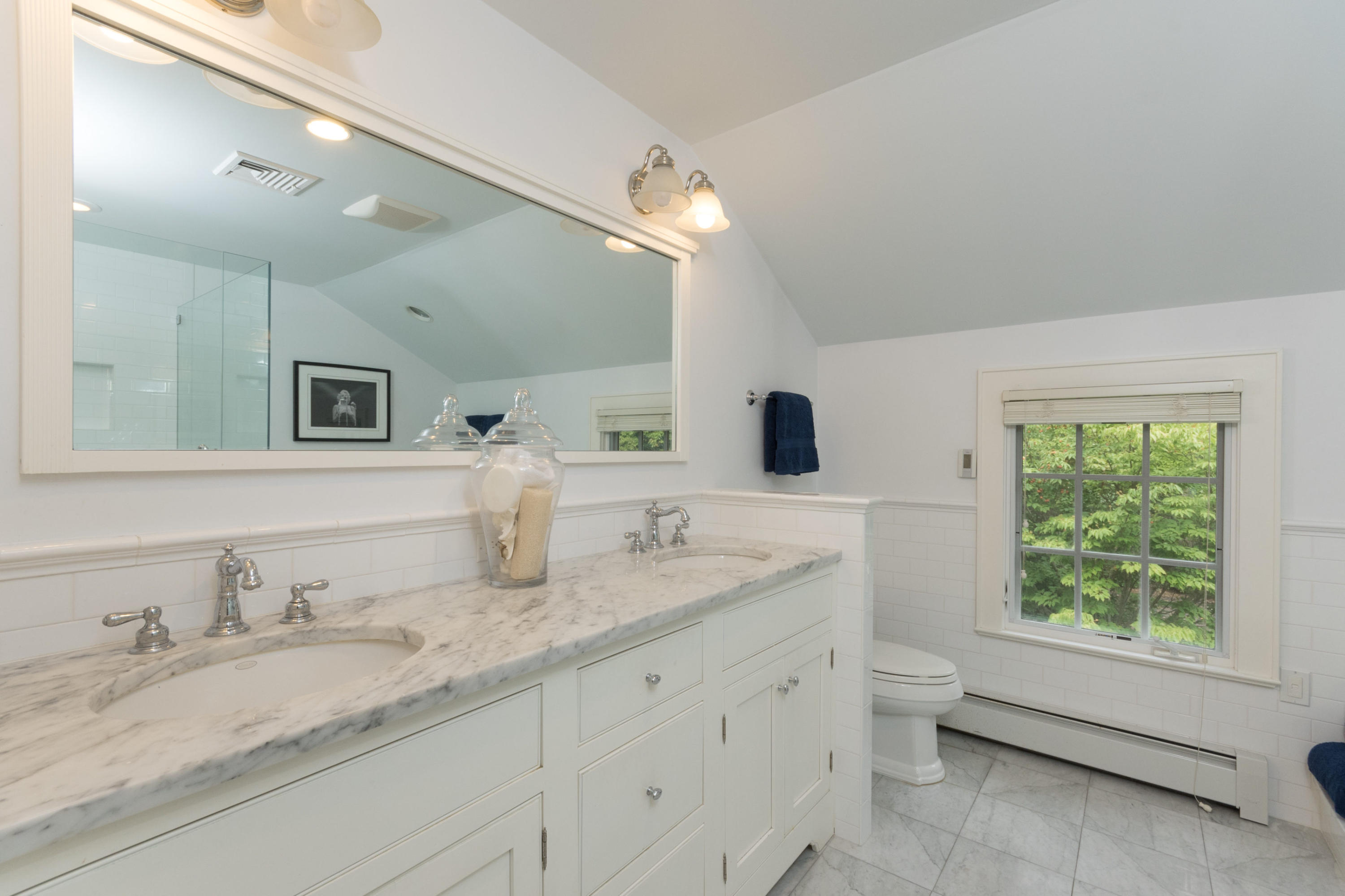 55 Cedar Gate Road Darien, CT 06820 - Photo 25 of 41 a bathroom with double sink and a mirror