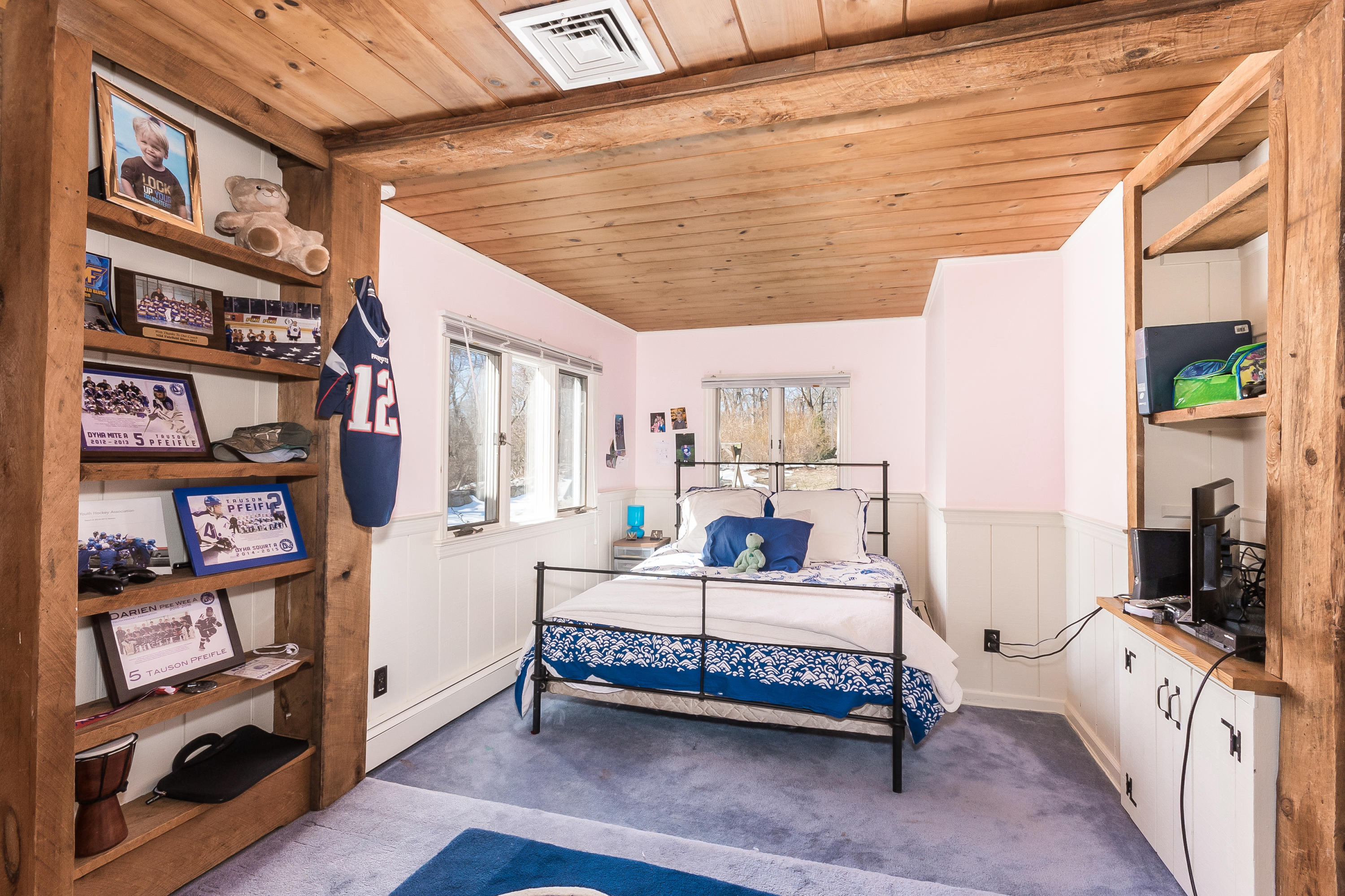 55 Cedar Gate Road Darien, CT 06820 - Photo 30 of 41 a bedroom with furniture and a book shelf