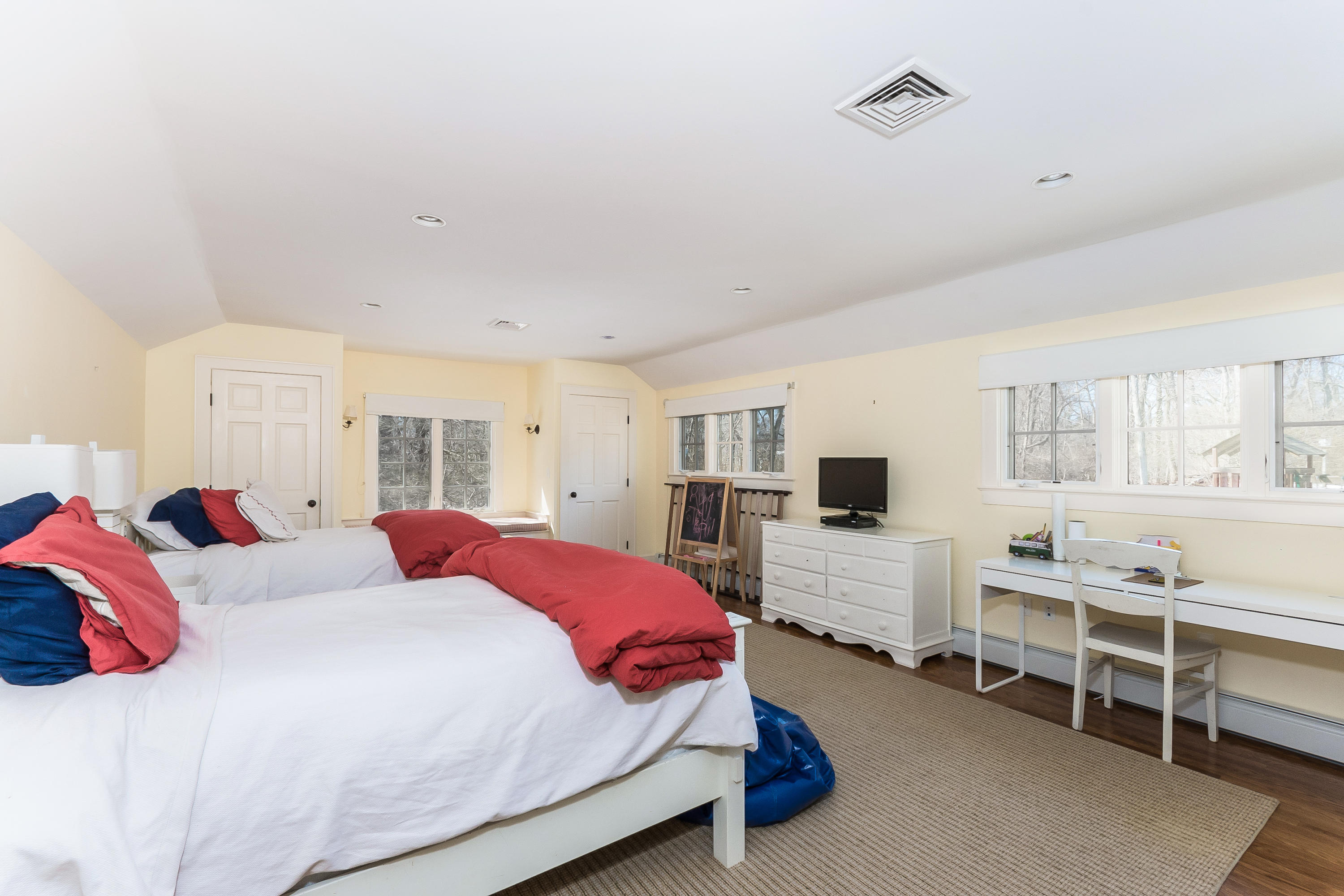 55 Cedar Gate Road Darien, CT 06820 - Photo 32 of 41 a bedroom with a bed and a flat screen tv