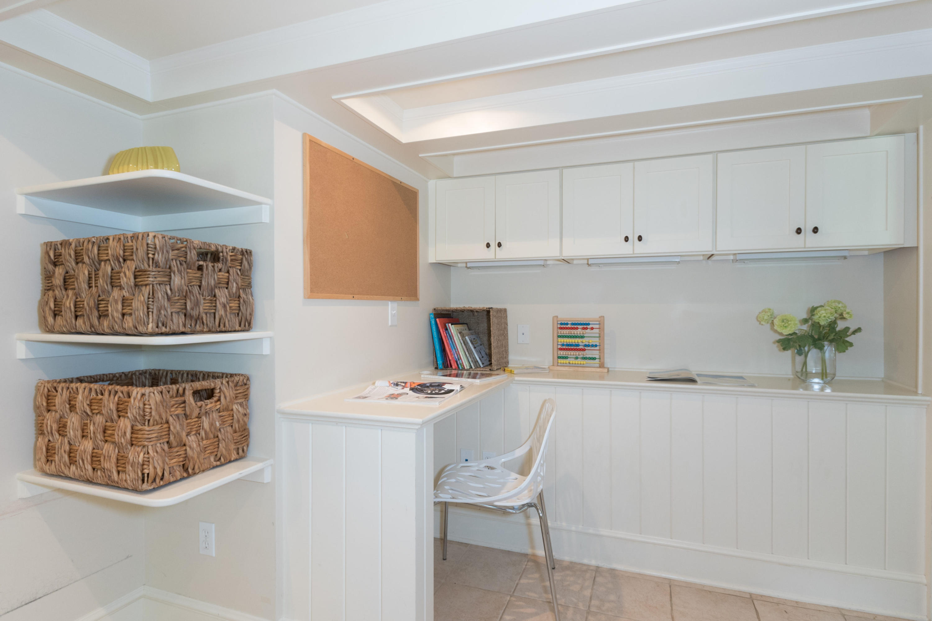55 Cedar Gate Road Darien, CT 06820 - Photo 34 of 41 a white kitchen with a white stove top oven and a white table