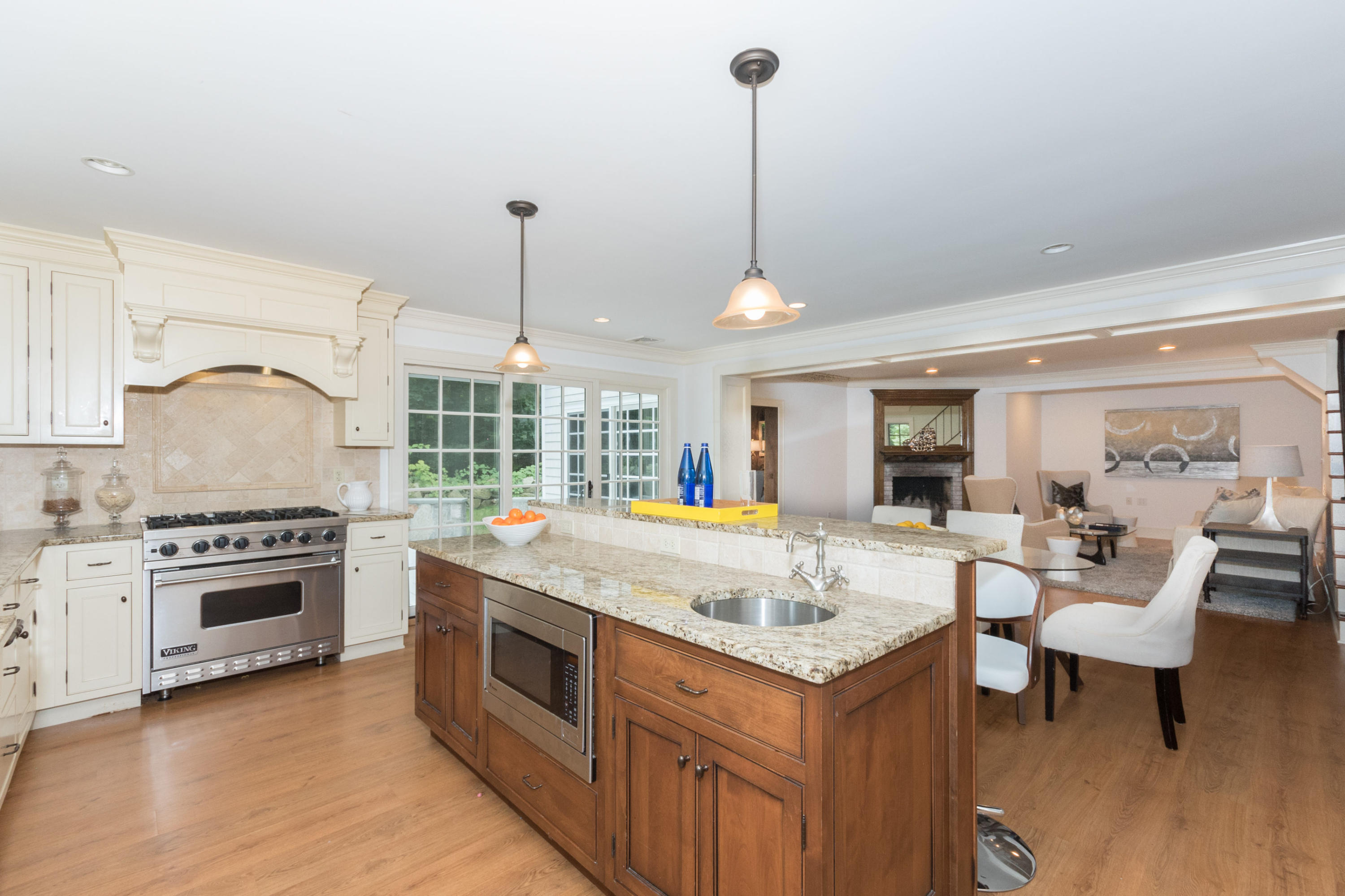 55 Cedar Gate Road Darien, CT 06820 - Photo 6 of 41 a kitchen with a stove sink and living room view